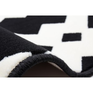 Detailansicht des modernen Teppichs Icon 310 in Schwarz-Weiß mit geometrischem Muster.