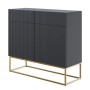 Modernes Selsey Sideboard Veldio 100 cm, schwarz, mit geriffelter Front, 2 Schubladen und goldenen Beinen.