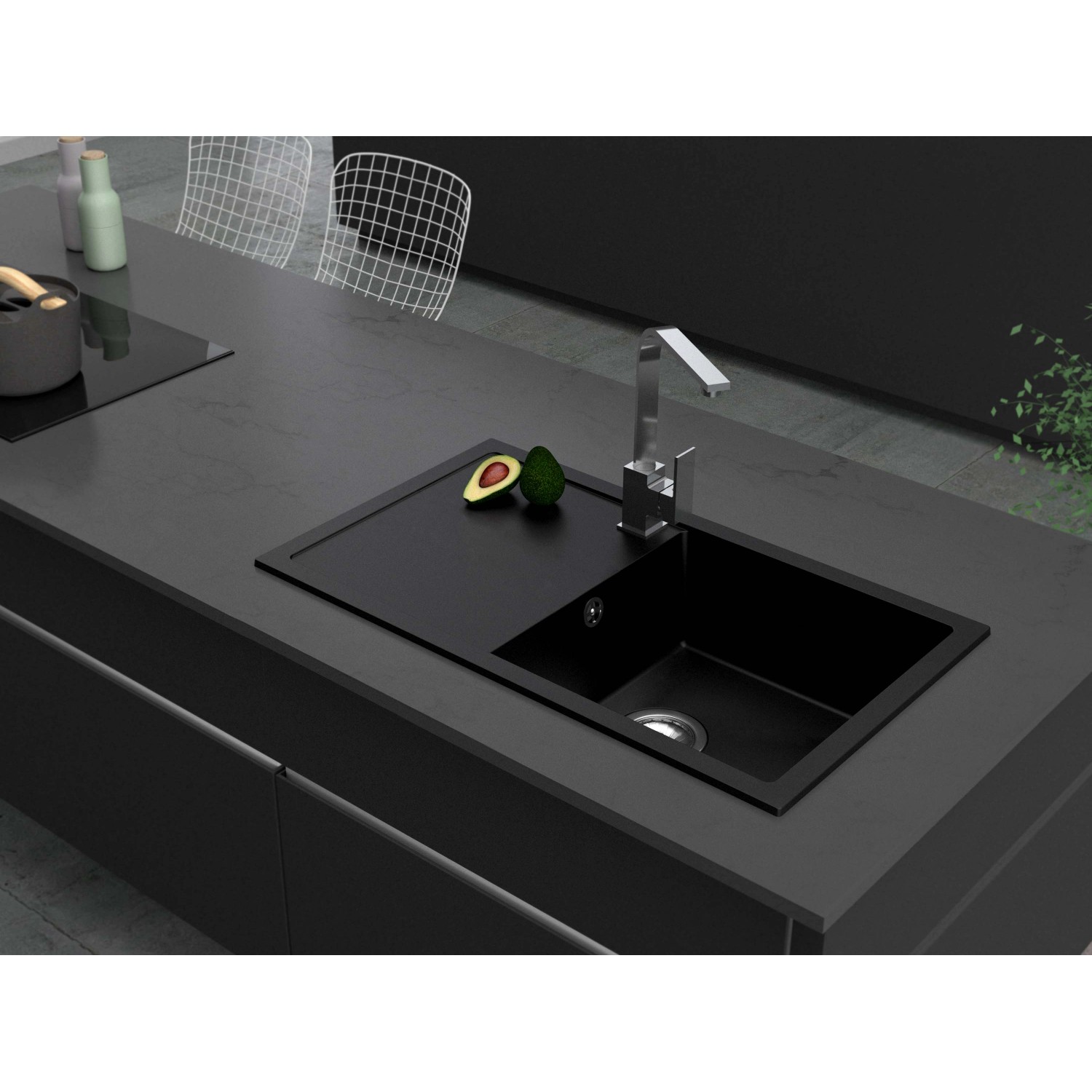 Schwarze Miló Einbauspüle Blissano aus Granitverbundstoff mit Armatur und Avocado auf Arbeitsplatte.