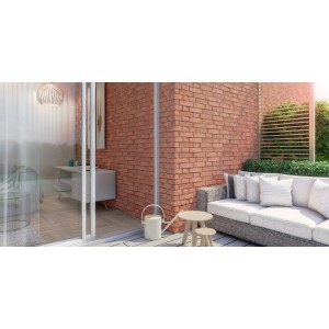 Stegu Verblender Monsanto Rot in Backsteinoptik an einer Hauswand mit Sitzbereich.