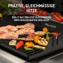 Weber Gasgrill E-210 Spirit mit Grillgut: Fisch, Gemüse und Tomaten auf dem Grillrost.