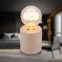 Beige Brilo Tischleuchte Tubo aus Keramik, Ø 10 cm, mit Leuchtmittel im Wohnraum.