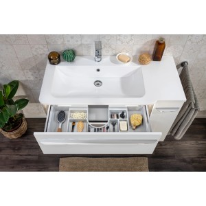 Fackelmann Marmor-Waschbecken Luxor, 100 cm, links, mit offenem Schubfach und Badutensilien.