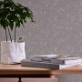 A.S. Création Vliestapete Blätter Grau mit feinem Blattmuster auf grauer Wand.