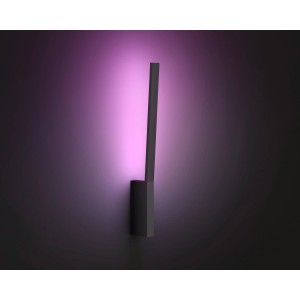 Schwarze Philips Hue LED Wandleuchte Liane mit farbigem Lichtschein.