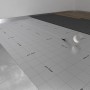Selitstop Komfort-Feuchteschutz 26 m² als Trittschalldämmung mit Raster auf dem Boden.