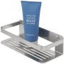 Tiger Duschkorb Caddy aus gebürstetem Edelstahl mit blauer Lotion.