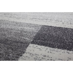 Detailansicht des silbernen Lalee Teppich Feeling 501 (160x230 cm) mit Patchwork-Muster.