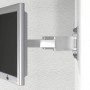 TV-Wandhalterung in Silber mit montiertem Bildschirm an einer weißen Wand.