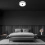 Moderne LED-Deckenleuchte Block von Briloner mit schwarzen Ringen, neutralweißes Licht im Schlafzimmer.