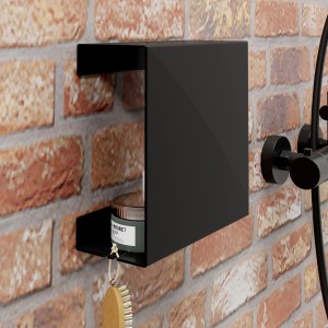 Schulte Duschablage zum Kleben, mattschwarz, Größe L, an einer Wand befestigt.