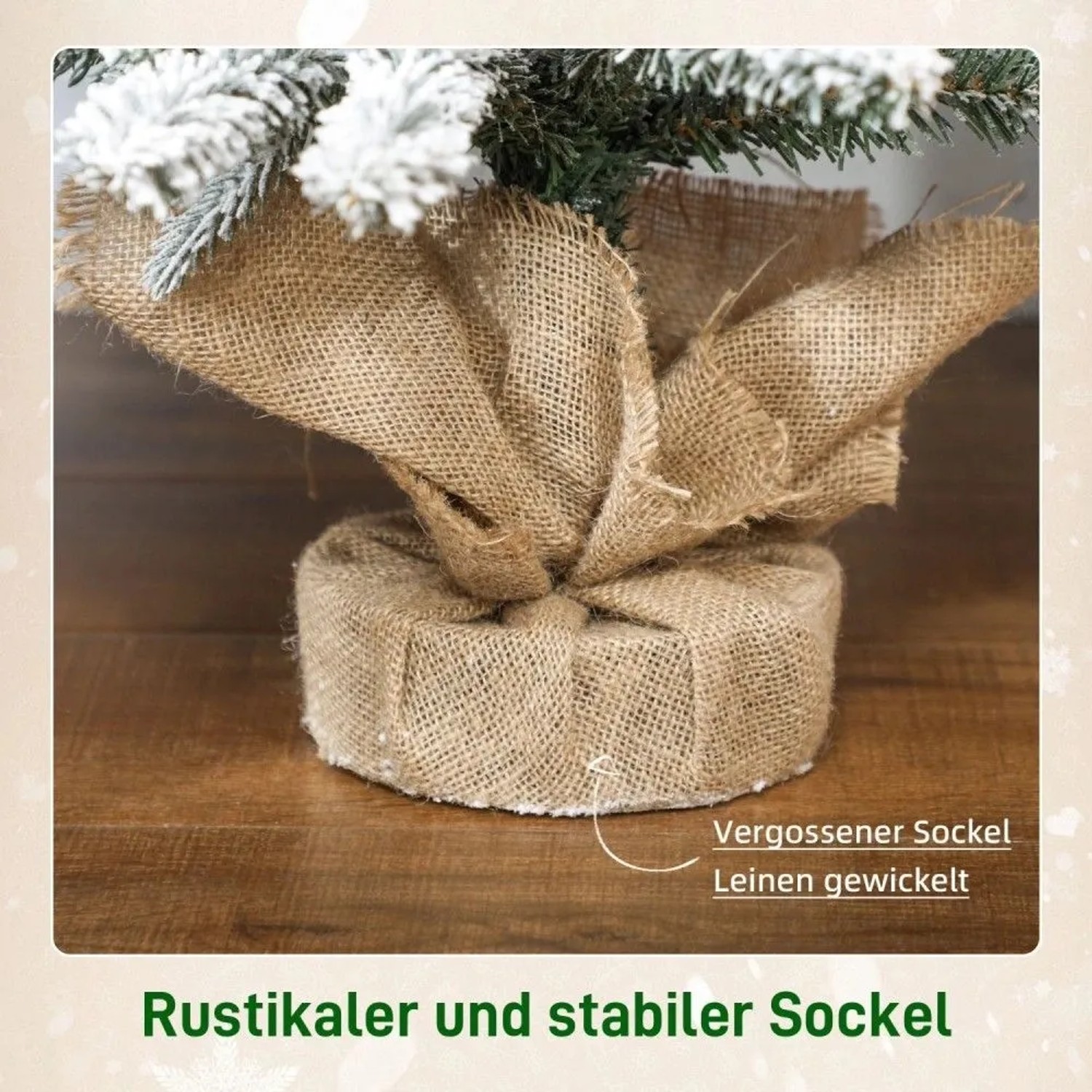 Detailansicht des stabilen, mit Leinen umwickelten Sockels eines künstlichen Weihnachtsbaums mit verschneiten Zweigen.