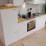 Weiße Respekta Küchenzeile KB270WWC (270 cm) mit E-Geräten und Spüle.