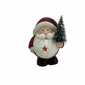 Weihnachtsmann Figur Ruth, rot, mit kleinem Tannenbaum, festliche Weihnachtsdekoration.