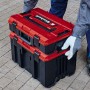 Gestapelter Einhell Systemkoffer E-Case M, rot-schwarzer Werkzeugkoffer mit Tragegriff.
