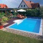 Steinbach Styropor Pool-Set Highlight, Einbaubecken 600x300x150 cm im Garten mit Liegen und Sonnenschirm.
