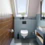 Badezimmer mit blau und braun gefliesten Wänden, modernisiert mit Alpina Fliesen-Lack Nordsee.