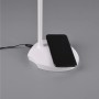 Weiße Reality LED-Touch-Tischlampe Load mit induktiver Ladestation und Smartphone.