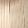 Detailansicht der geriffelten Seitenwand des Justus Kaminofen Mino 2.0 aus Stahl.