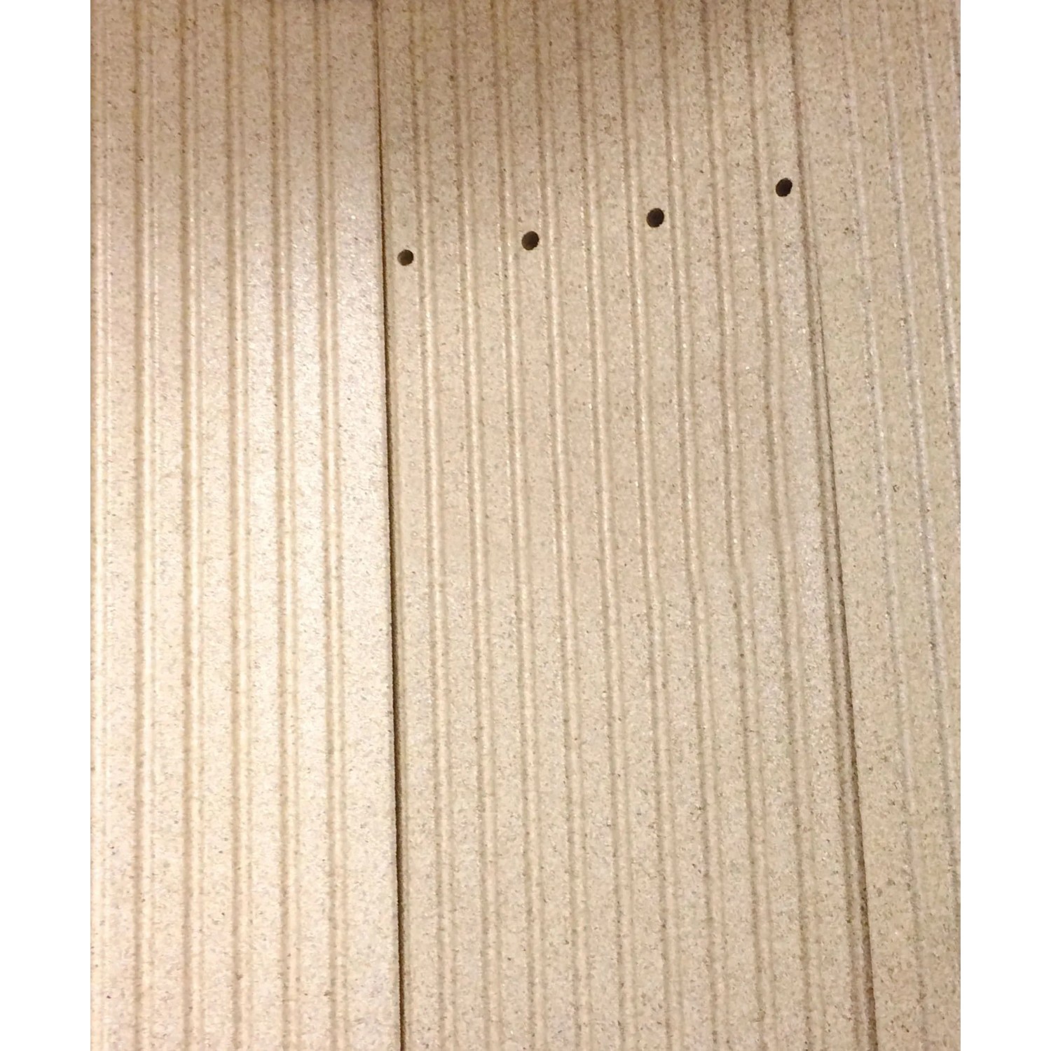 Detailansicht der geriffelten Seitenwand des Justus Kaminofen Mino 2.0 aus Stahl.