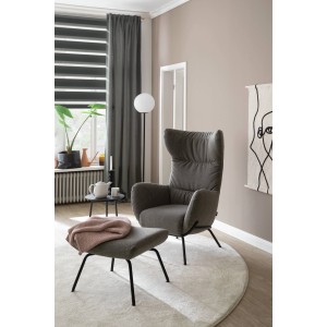 Schöner Wohnen Doppelrollo Tilda grau, 80x210cm im modernen Wohnraum mit Sessel und Dekoration.