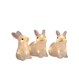 Drei leuchtende Acryl-Kaninchen mit warmweißen LEDs, ideal als Außen-Weihnachtsfiguren. Batteriebetrieben.