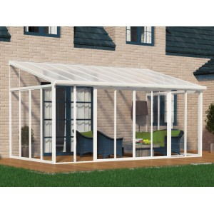 Weißer Palram Canopia SanRemo Wintergarten 3x4.25 m mit Terrassenmöbeln vor Backsteinhaus.