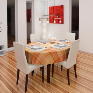Esstisch mit orangefarbener d-c-fix Tischdecke Valova Mandarine mit Karomuster.
