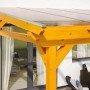 Freistehende Skan Holz Terrassenüberdachung Sanremo aus Leimholz in Eiche hell mit klarer Dacheindeckung.
