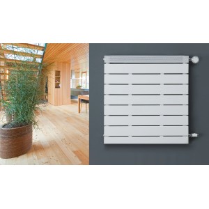 Weißer Ximax Badheizkörper PEP (650x500 mm, 289 Watt) an grauer Wand.