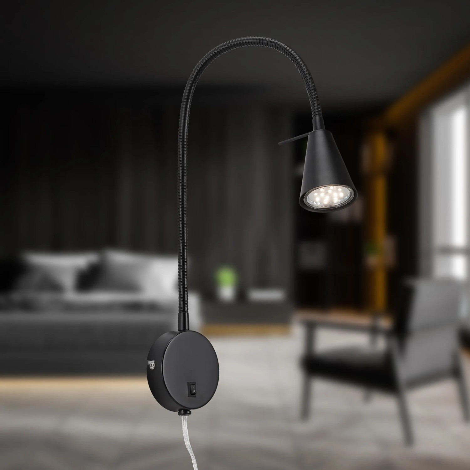 Schwenkbare, schwarze LED Bettleuchte Tusa (45x20,5 cm) mit warmweißem Licht für Nachttisch oder Wand.