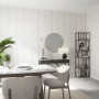 Graue Marburg Vliestapete mit Marmor- und Putzoptik im modernen Wohnraum.
