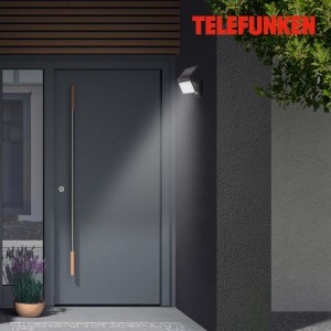 Telefunken LED-Solar-Außenleuchte Metz Schwarz an Hauswand, spendet Licht.