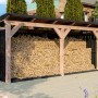 Skan Holz Holzunterstand Holm 2 aus Douglasie und Fichte Anthrazit, gefüllt mit Brennholz im Garten.