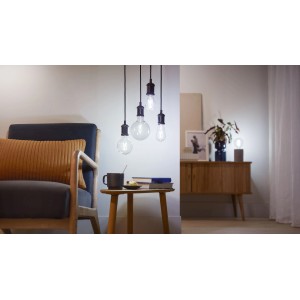 Philips Smart LED-Filament Leuchtmittel E27, 60W, Standardform, klar, im Wohnraum.