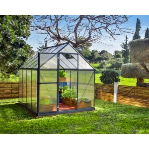 Graues Palram Canopia Gewächshaus 4,6 m² mit Fundamentrahmen im Garten.