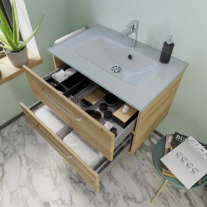 Pelipal Glas-Waschbecken Trentino 77 cm mit Unterschrank und zwei offenen Schubladen.