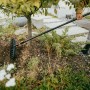 Fiskars Universal-Gartenrechen OneClick in Aktion, orange-schwarz, für Kombisysteme.