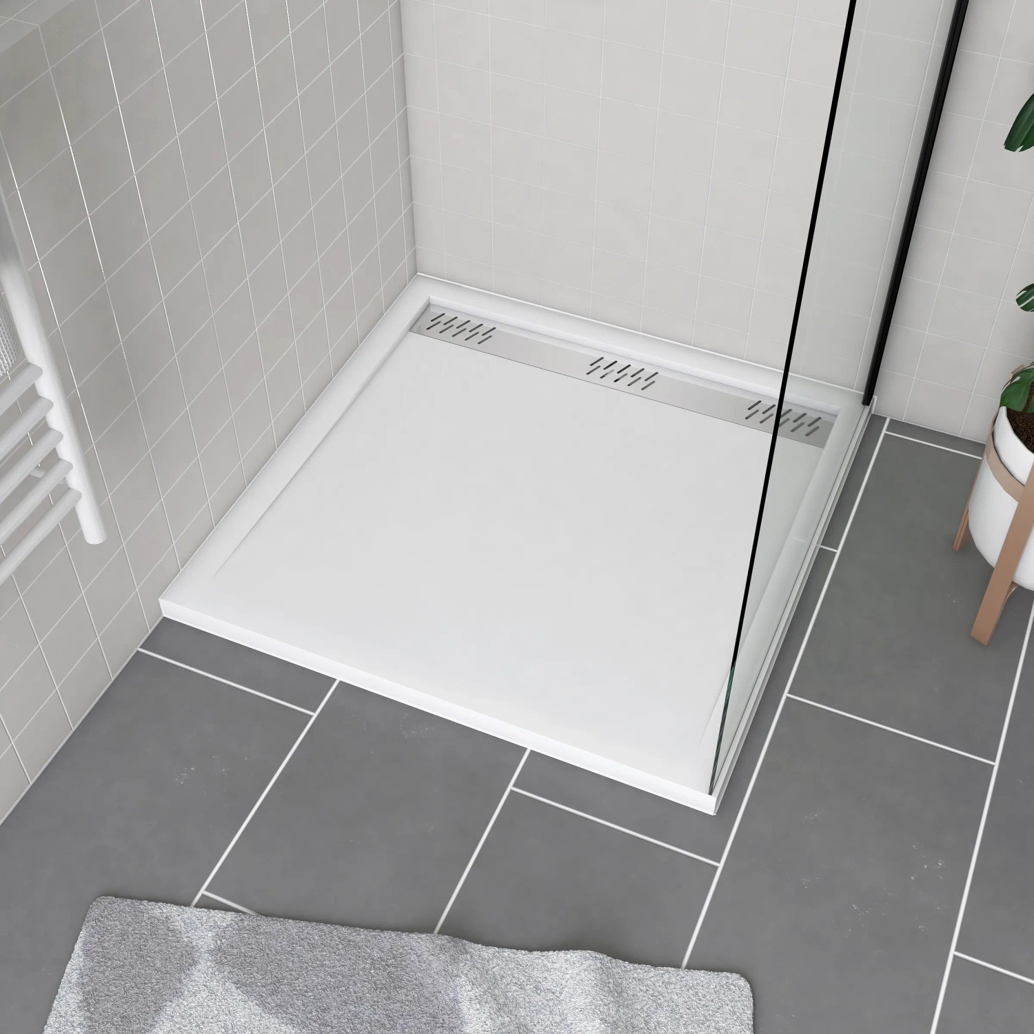 Weiße, flache baliv Duschtasse 90x90 cm mit Ablaufgitter für barrierefreies Duschen.